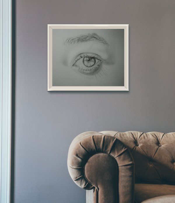 Catching Light - eye graphite pencil drawing framed as living room decoration (mockup)