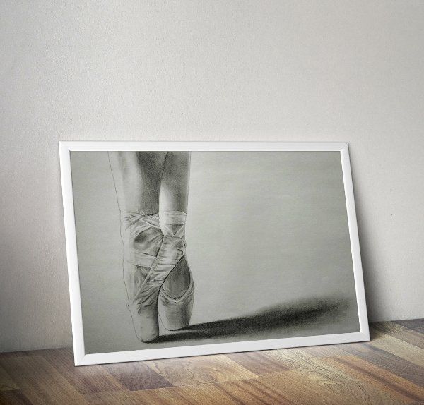 On Pointe drawing, white frame mockup against walll