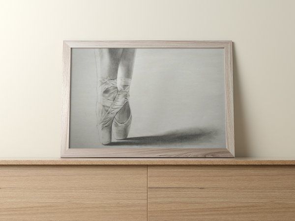 On Pointe drawing print mockup displayed on top of a light wooden dresser